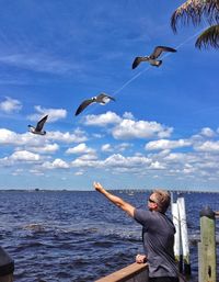 Scenic view of sea against cloudy sky