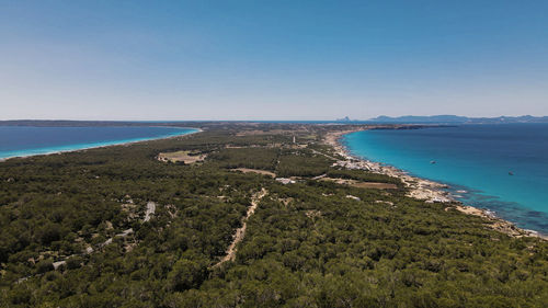 Scenic view of bay against clear sky