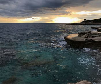 Scenic view of sea against sky during sunset