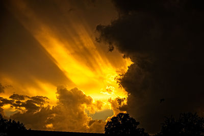 Low angle view of dramatic sky during sunset