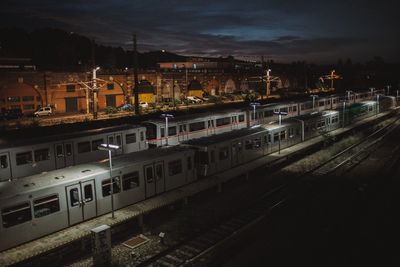 High angle view of railway tracks at night