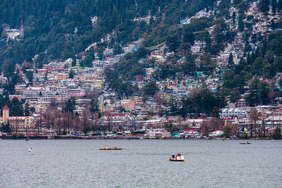 High angle view of buildings by sea