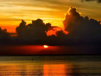 Scenic view of sea against romantic sky at sunset