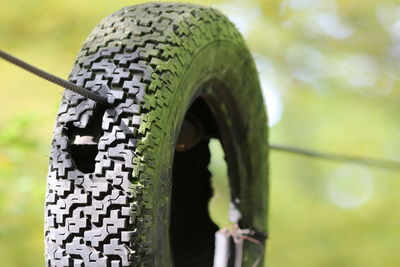 Close-up of tire against black background