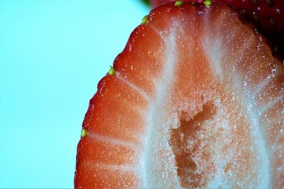 Macro view on sliced strawberry against nc light blurred background