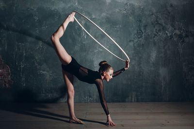 Gymnast girl dancing with hoop