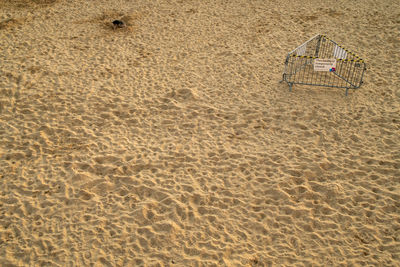 High angle view of text on sand at beach