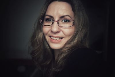 Close-up portrait of woman wearing eyeglasses