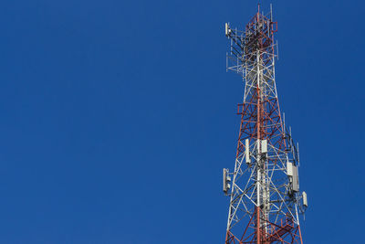 Mobile telephone towers with background in the sky