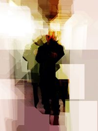 Rear view of woman standing in corridor