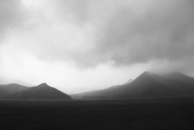 Scenic view of landscape and mountains against sky