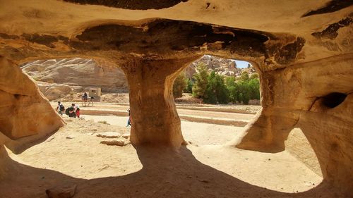 Rear view of man in cave