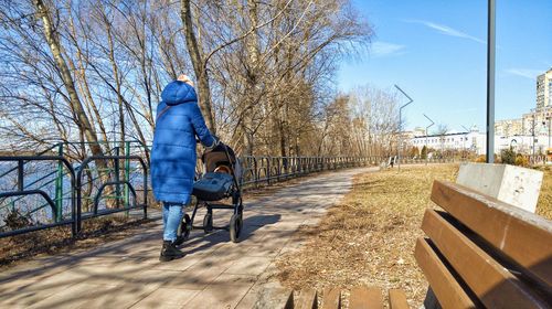 Rear view of man walking on street