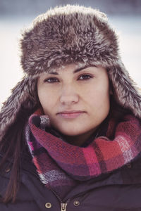 Portrait of confident woman wearing fur hat