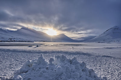 Scenic view of snowcapped mountains against sky during winter