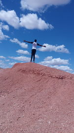 Low angle view of man standing on beach