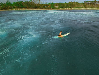 High angle view of man swimming in sea