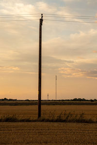 Scenic view of field against sky during sunset