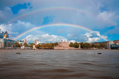 Beautiful view of the tower bridge in london with a full rainbow over it