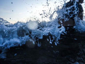 Close-up of sea waves against sky