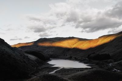 Scenic view of landscape against sky during sunset