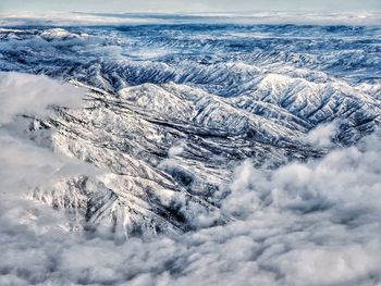 Aerial view of snow covered mountains