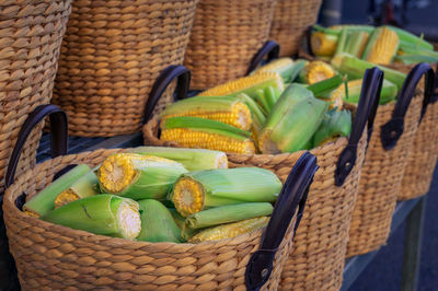 Vegetables in basket for sale at market stall