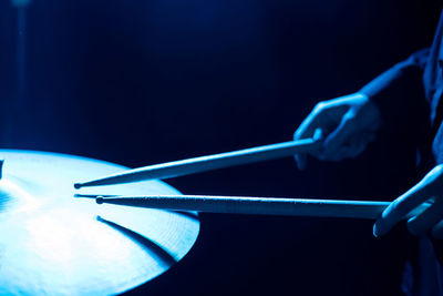 Close-up of hand holding blue ball