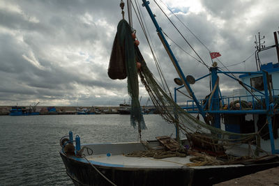 Boats moored at harbor