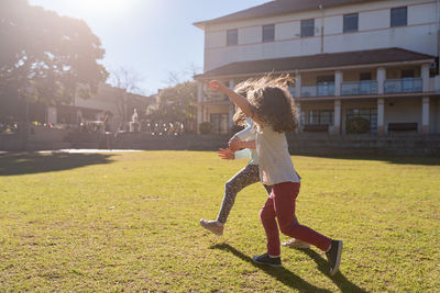 Full length of girl playing in park