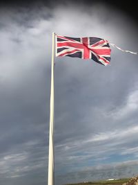 Low angle view of flag against sky