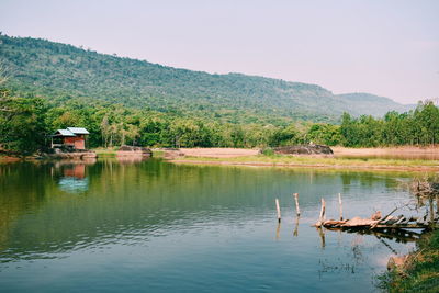 Scenic view of lake and mountains against sky