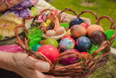 Close-up of hand holding basket