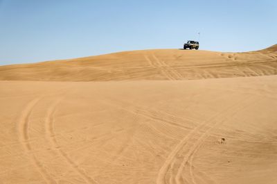 Scenic view of desert against clear sky