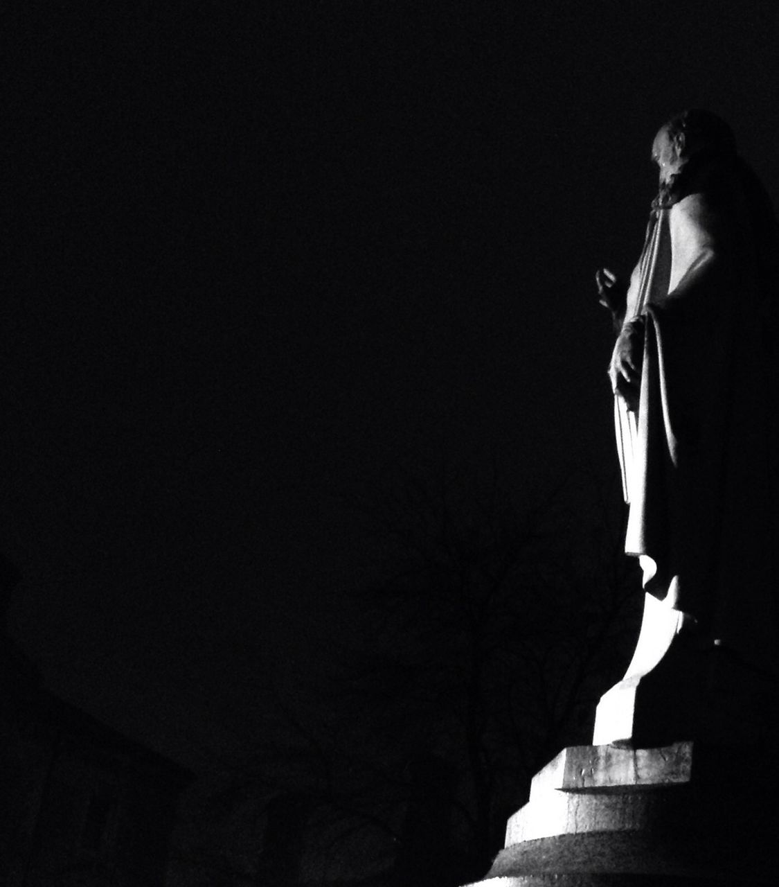 clear sky, copy space, built structure, architecture, building exterior, low angle view, religion, spirituality, sky, outdoors, statue, silhouette, night, place of worship, sculpture, no people, human representation, tranquility