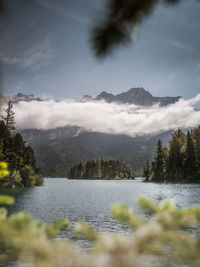 Scenic view of lake and mountains against sky