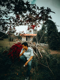 Young man standing on field