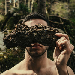 Close-up portrait of shirtless man