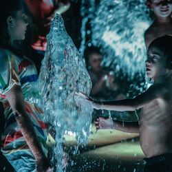 Woman jumping in water