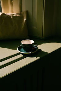 High angle view of coffee cup on table