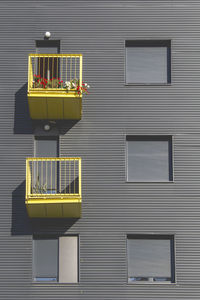 Low angle view of yellow window on building