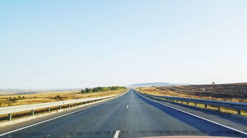 Road amidst landscape against clear sky