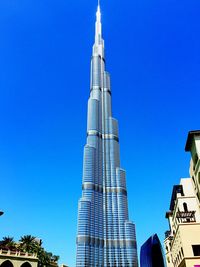 Low angle view of building against blue sky