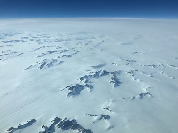 Aerial view of frozen sea against sky