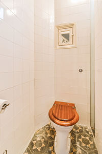 Cropped image of woman standing in bathroom