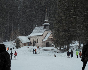 Group of people on snow covered landscape