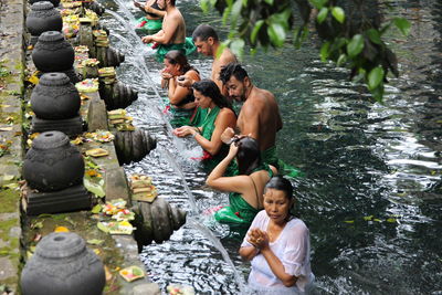 Full length of father with daughter in water