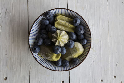 High angle view of chopped fruits in bowl on table