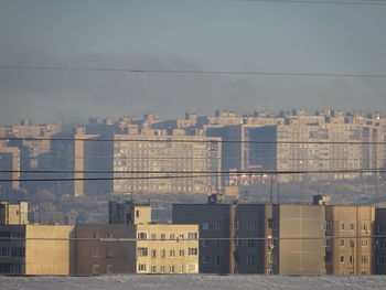Buildings in city against sky