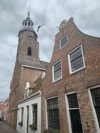 Low angle view of old building against sky